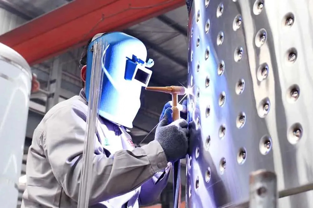 Workers are making stainless steel beer equipment